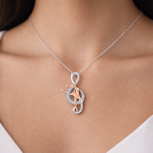Silver and rose gold tone ballerina necklace with rhinestone details, elegant dance jewelry pendant