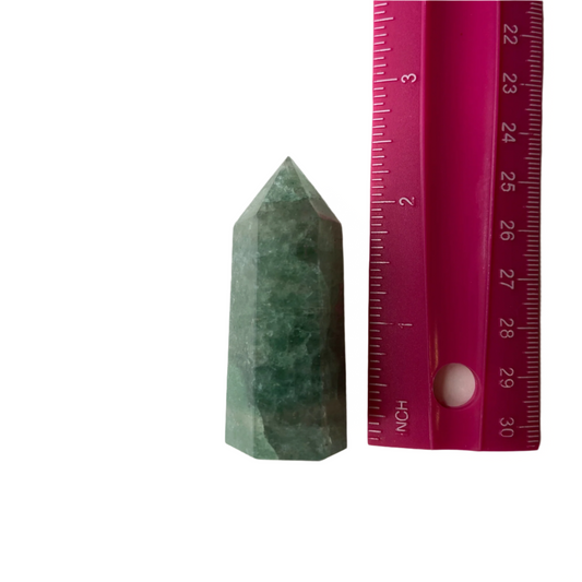 Green Strawberry Quartz tower, promotes emotional balance, heart-centered energy, personal growth, and manifestation; symbolizes amplified energy and focus.