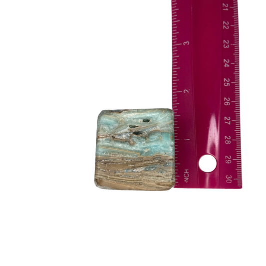 Aragonite crystal with earthy tones, promotes grounding, nurturing energy, stress relief, and connection to Mother Earth; symbolizes stability, emotional balance, and personal growth.