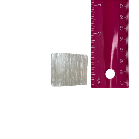 Selenite crystal, known as the Stone of Light, clears negative energy, amplifies other crystals, promotes spiritual awareness, and supports meditation and aura cleansing.