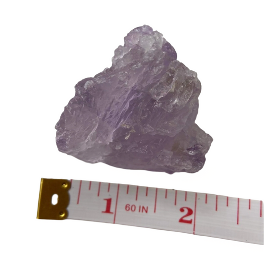 Raw amethyst, promotes calm, spirituality, intuition, meditation, and mental clarity; symbolizes natural, unrefined energy and pure spiritual flow.