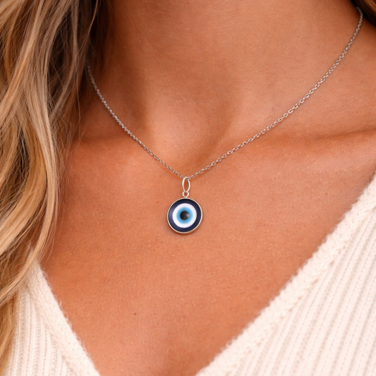 Silver tone evil eye necklace with blue protective eye pendant symbolic jewelry
