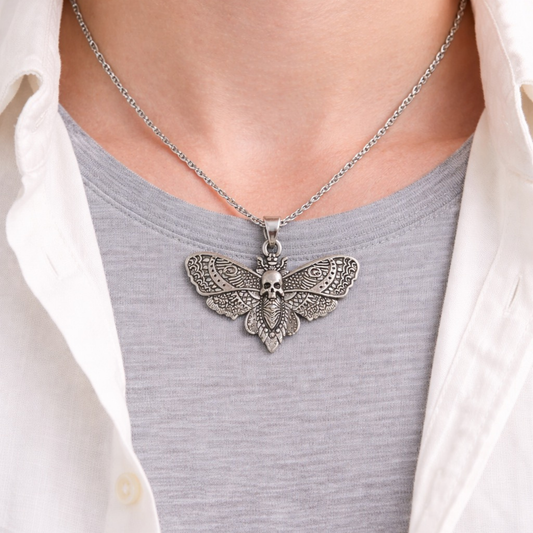 Silver tone skull moth necklace with detailed wings nature-inspired statement jewelry