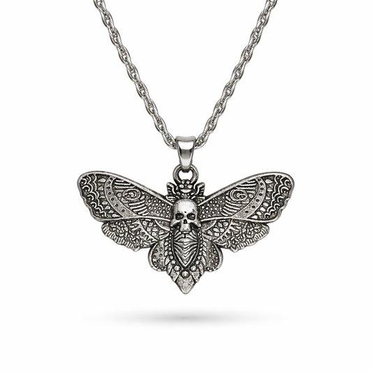 Silver tone skull moth necklace with detailed wings nature-inspired statement jewelry