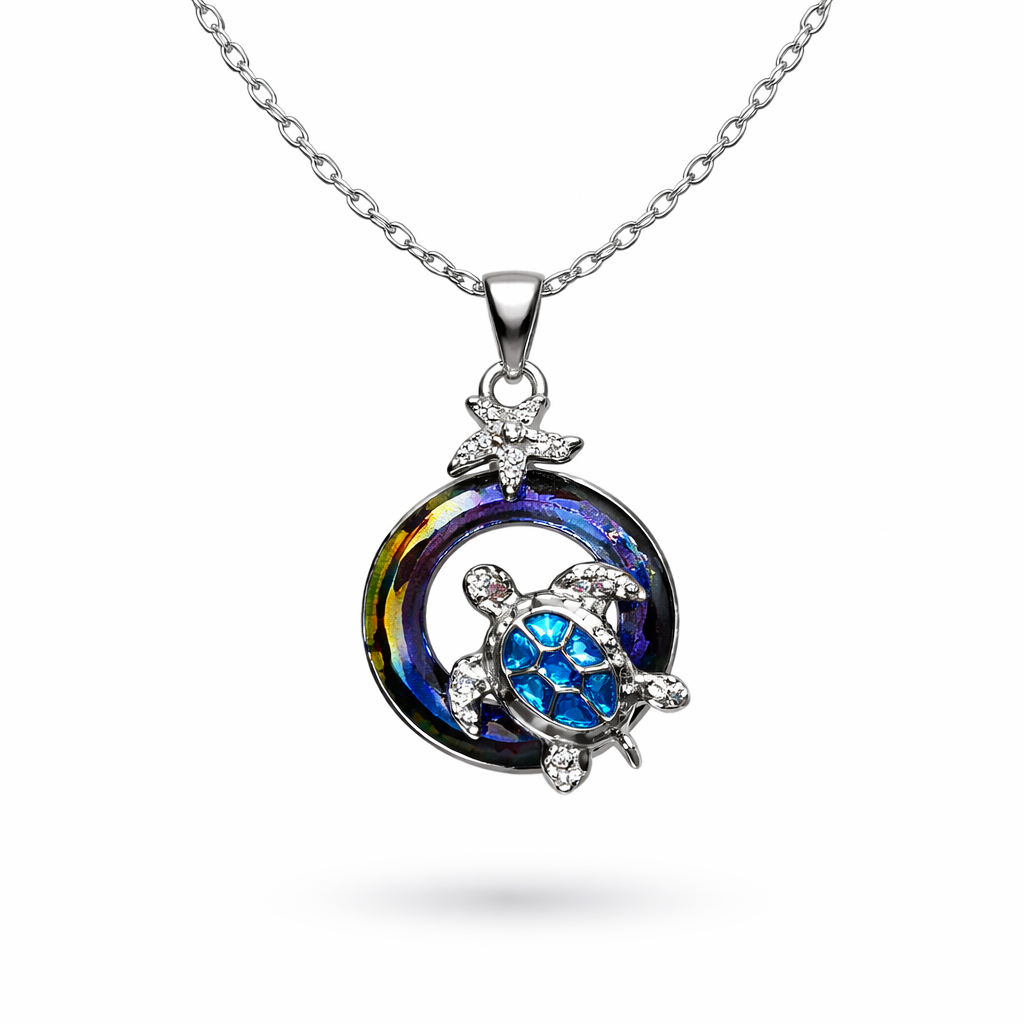 Silver tone sea turtle necklace with iridescent circle accent and starfish detail ocean-inspired jewelry