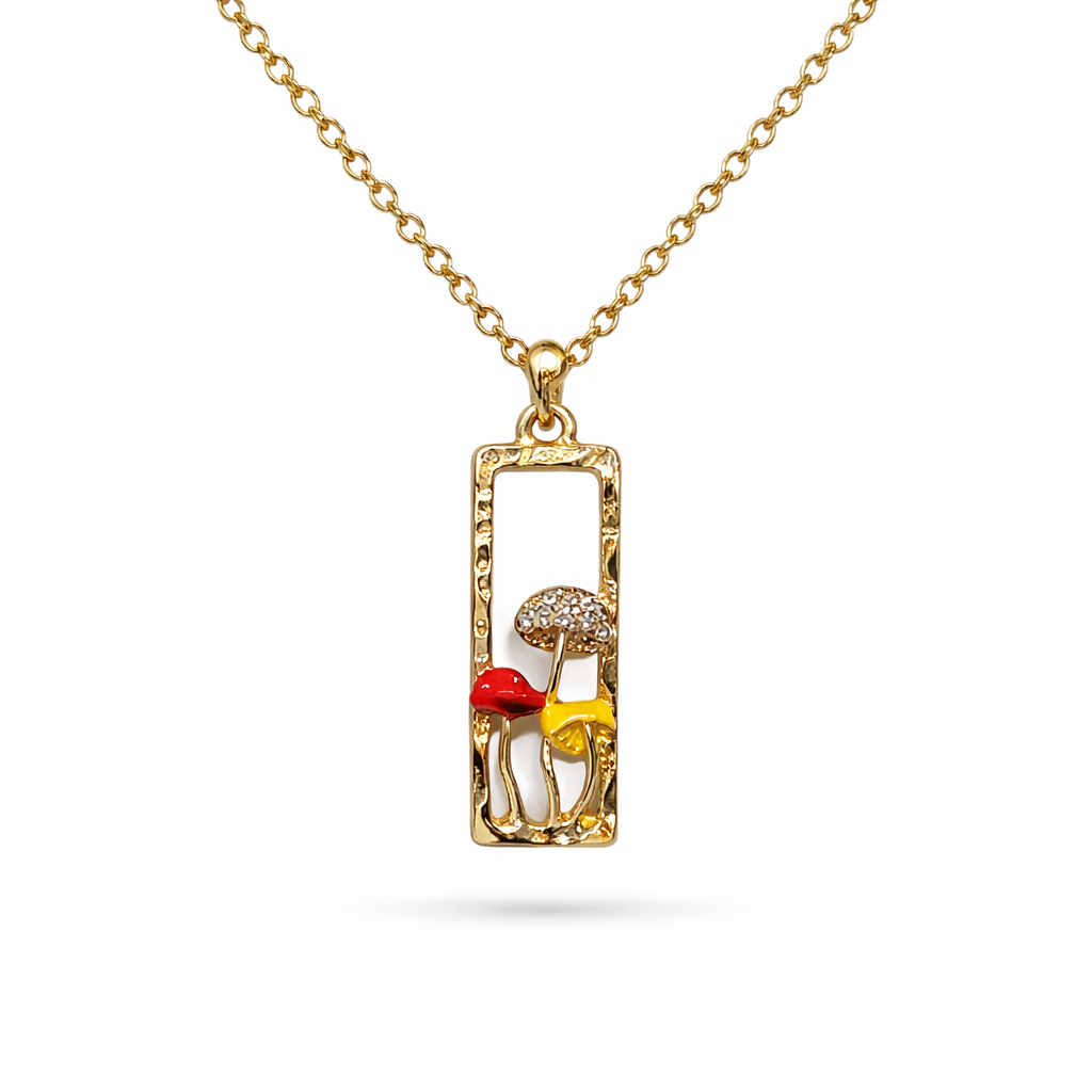 Gold tone necklace with rectangular pendant and colorful enamel mushrooms, whimsical forest-inspired jewelry