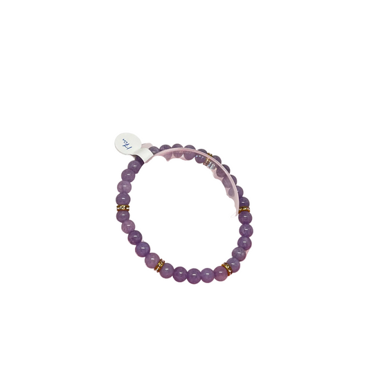 Handmade Lavender Quartz bracelet with 6mm dyed quartz beads in soft purple tones, 17cm length on elastic cord.
